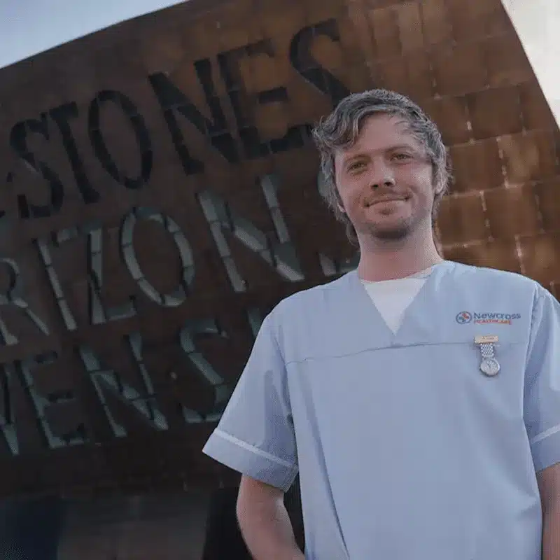 Healthcare professionals supporting a patient
